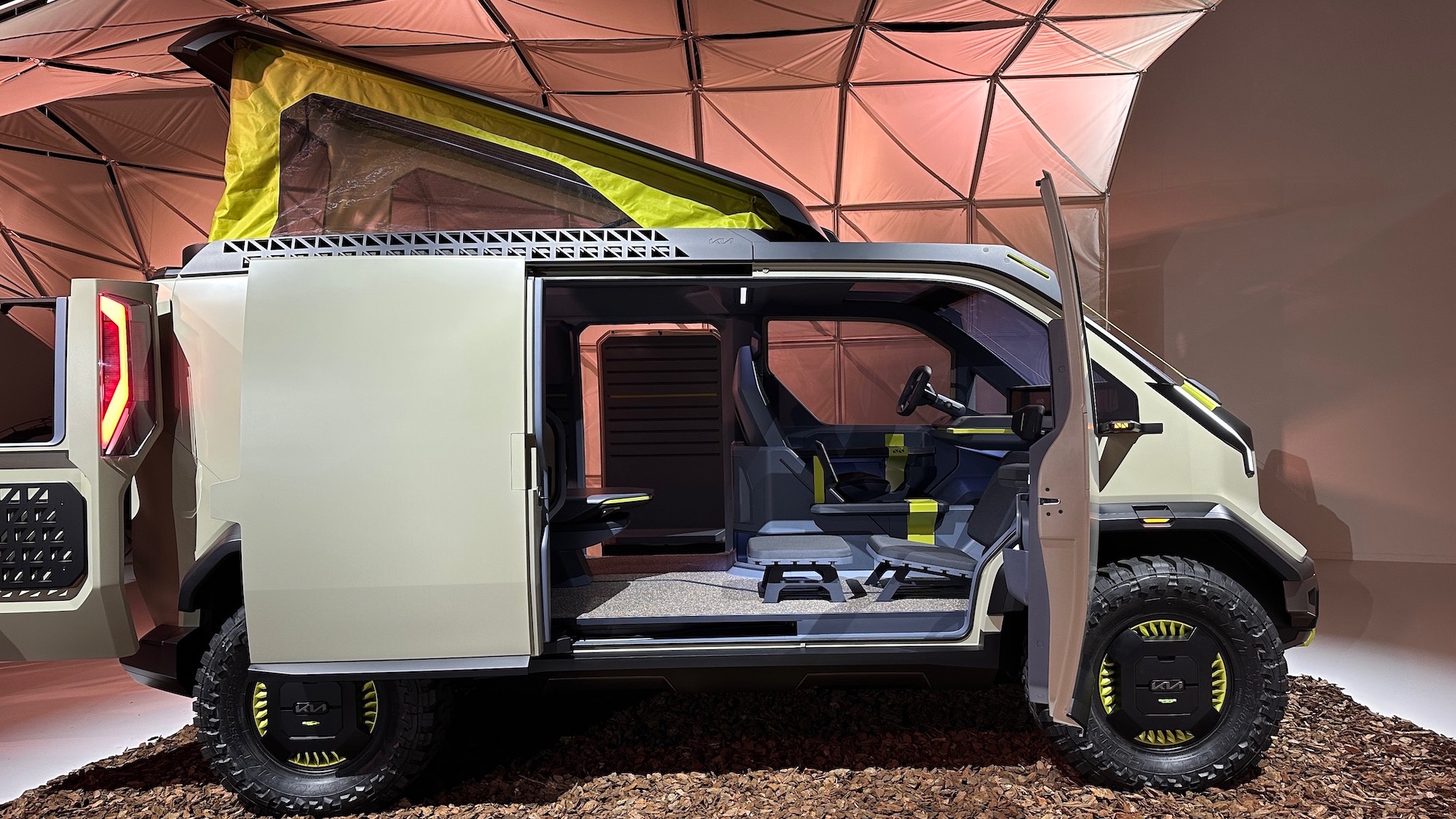 Kia’s wild concept EV includes hydro-turbine wheels, solar panels, and a rooftop tent