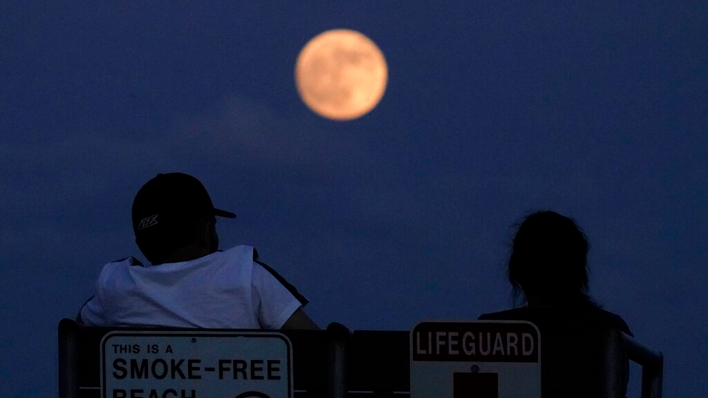 When you can see the rare low-hanging strawberry moon