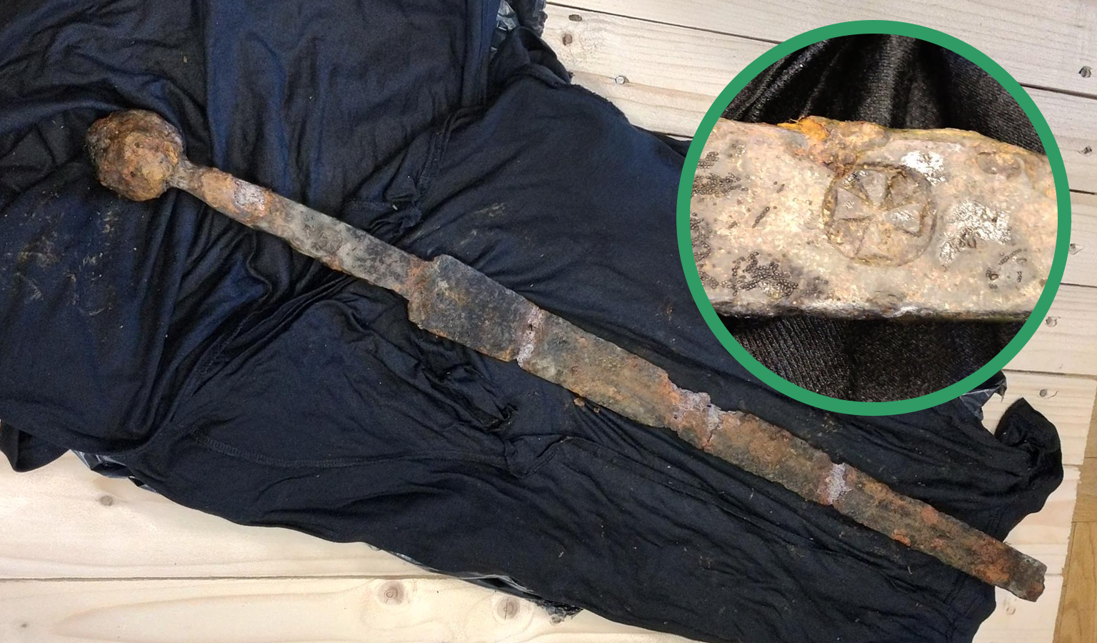 Angler unexpectedly fishes out a mysterious medieval sword
