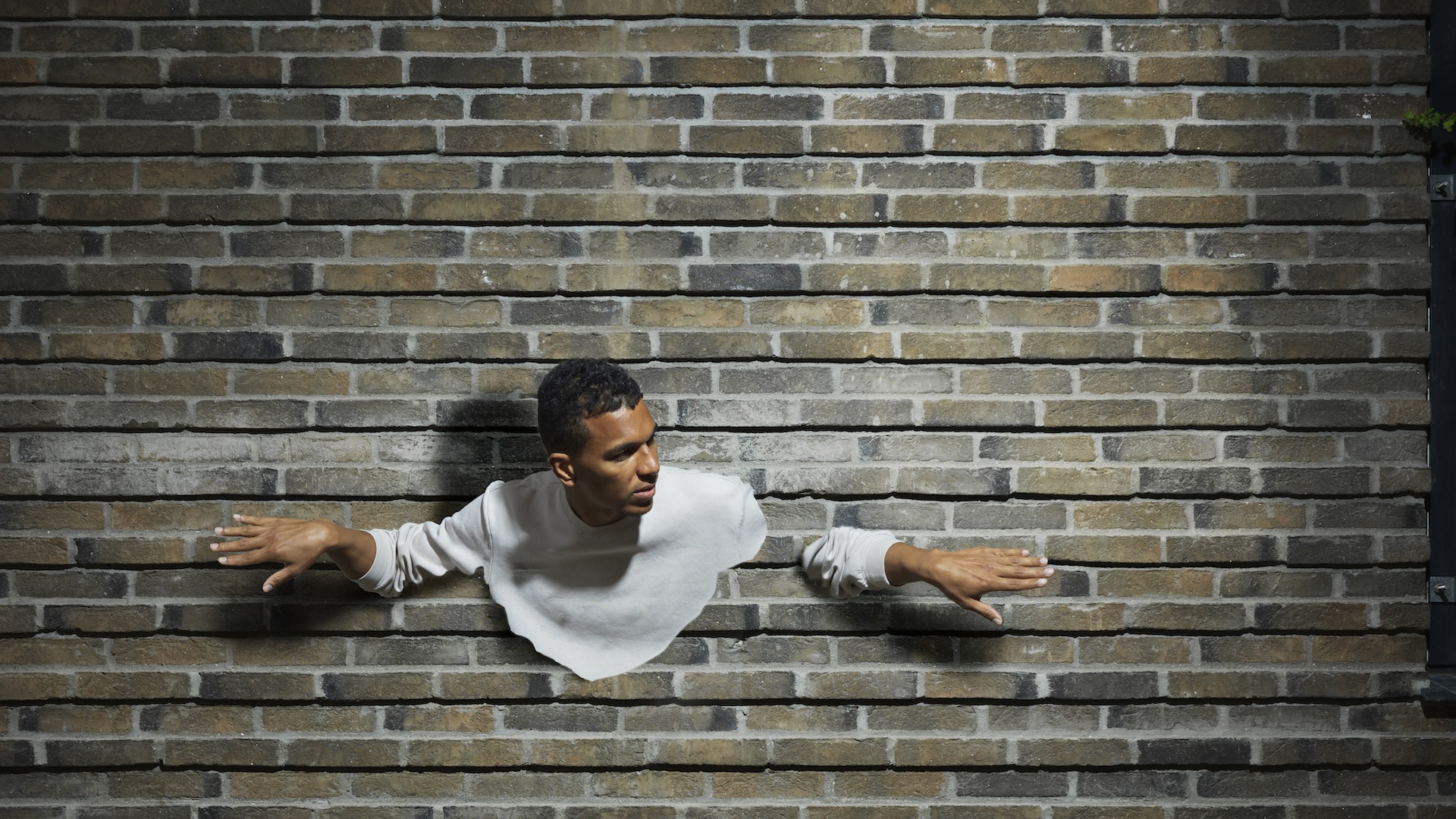 Why can’t we walk through walls if atoms are mostly empty space?