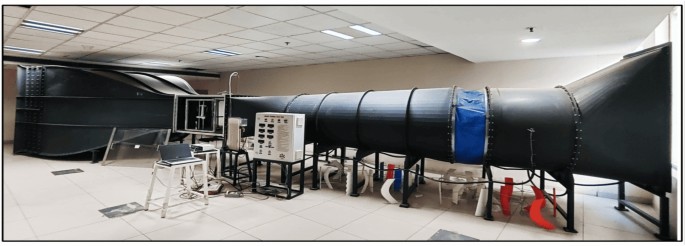 Bifurcation and synchronization analysis in a stall-flutter aeroelastic system under varying preset angles and frequency ratios