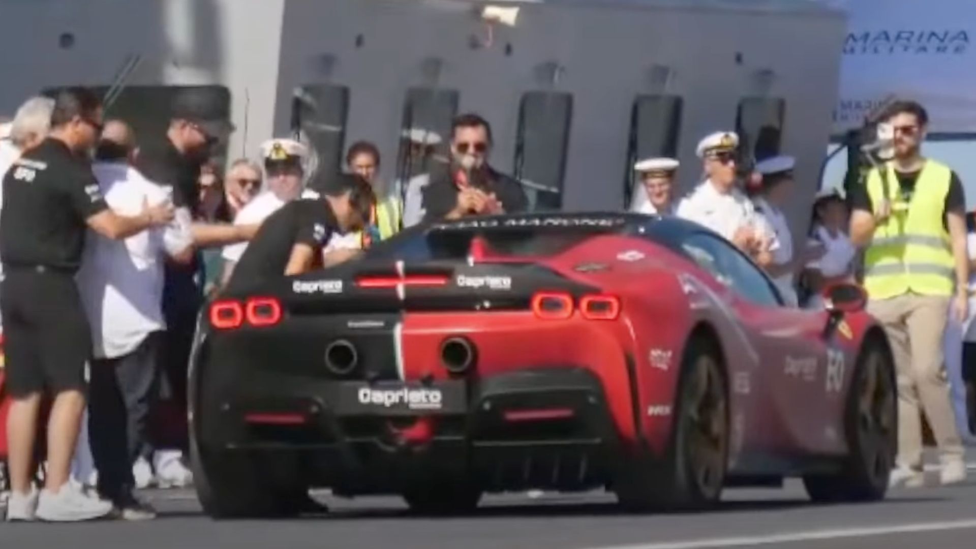 Ferrari SF90 hybrid EV sets 100-mph speed record on aircraft carrier