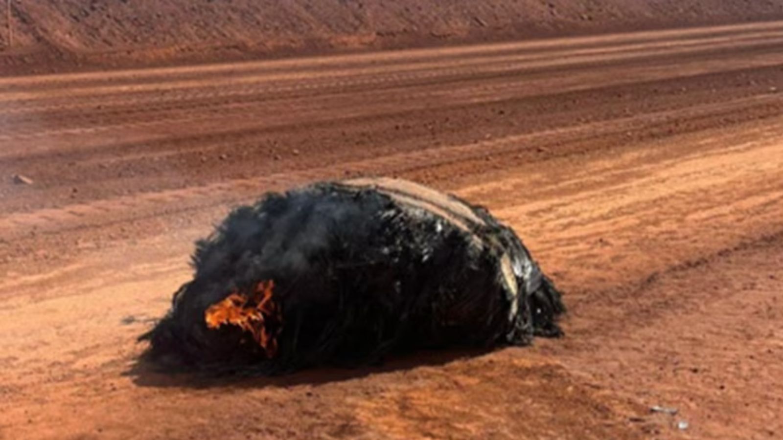 Charred lump of space debris, from secretive Chinese rocket, found still smoldering in the Australian outback
