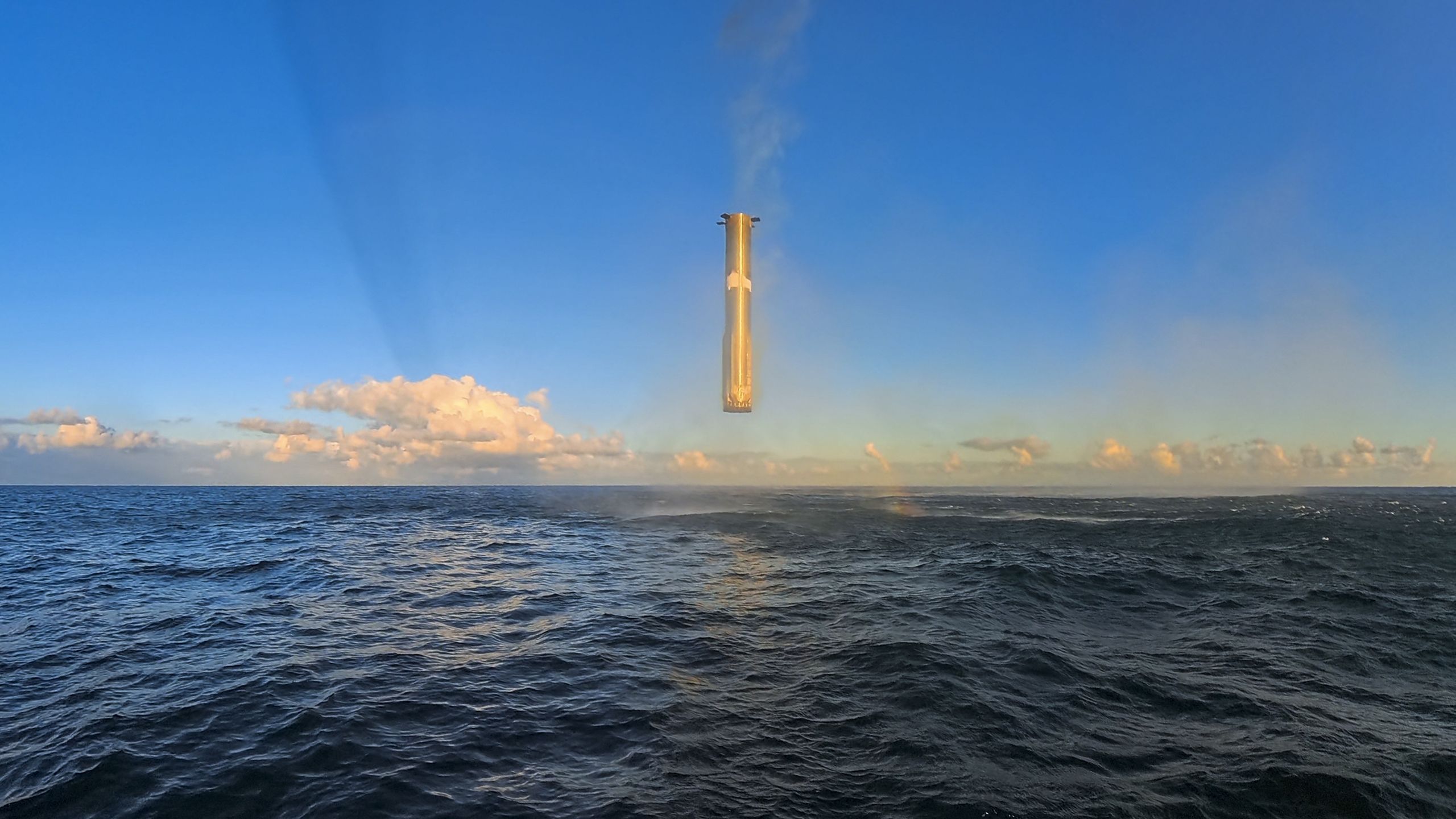 Watch SpaceX’s Super Heavy Starship booster hover in mid-air before plunging into the sea (video)