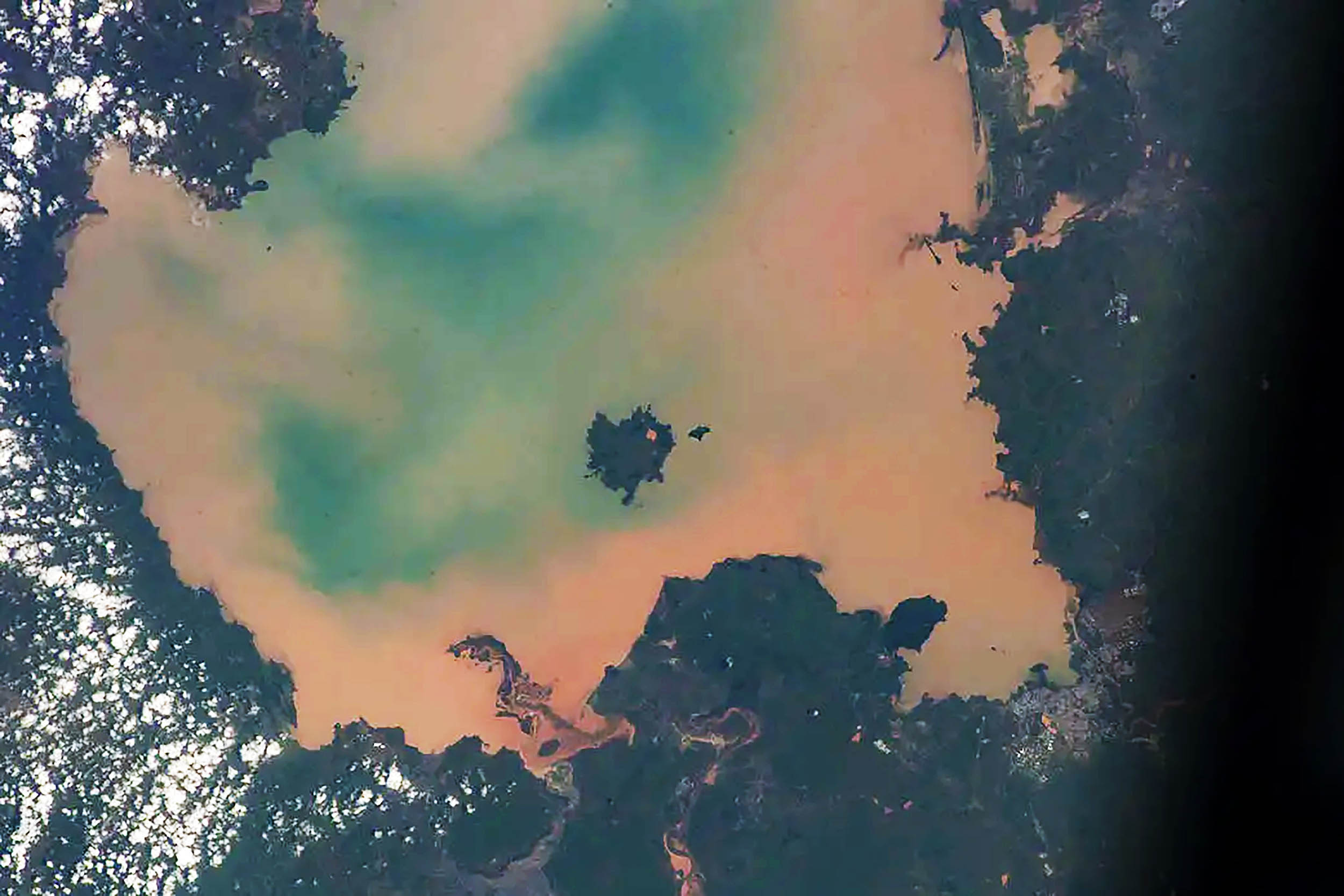 ISS astronaut discovers a sacred lake has turned toxic green