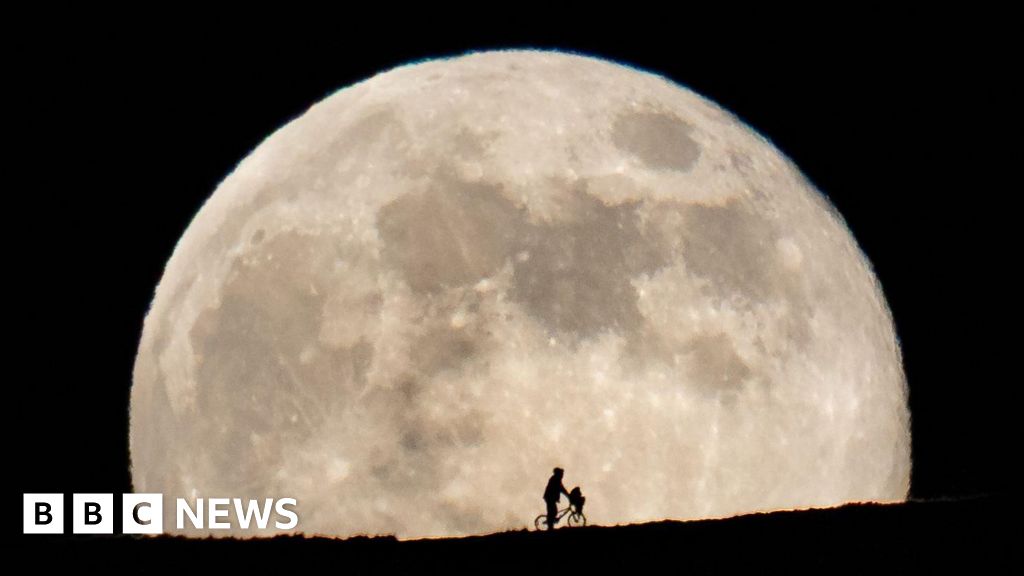 Photographer over the Moon with ET recreation on Eglwysilan Mountain