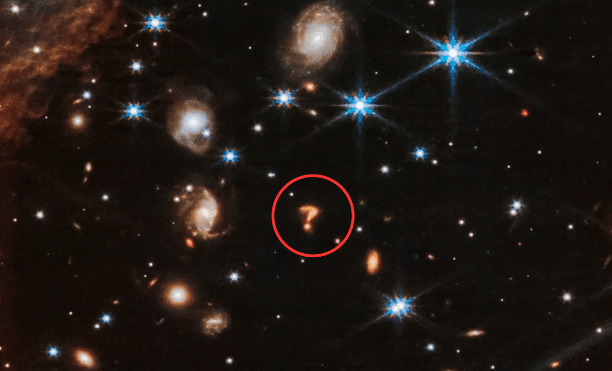 NASA’s Webb Telescope Spots a Giant ‘Cosmic Question Mark’ in the Heart of a Distant Galaxy