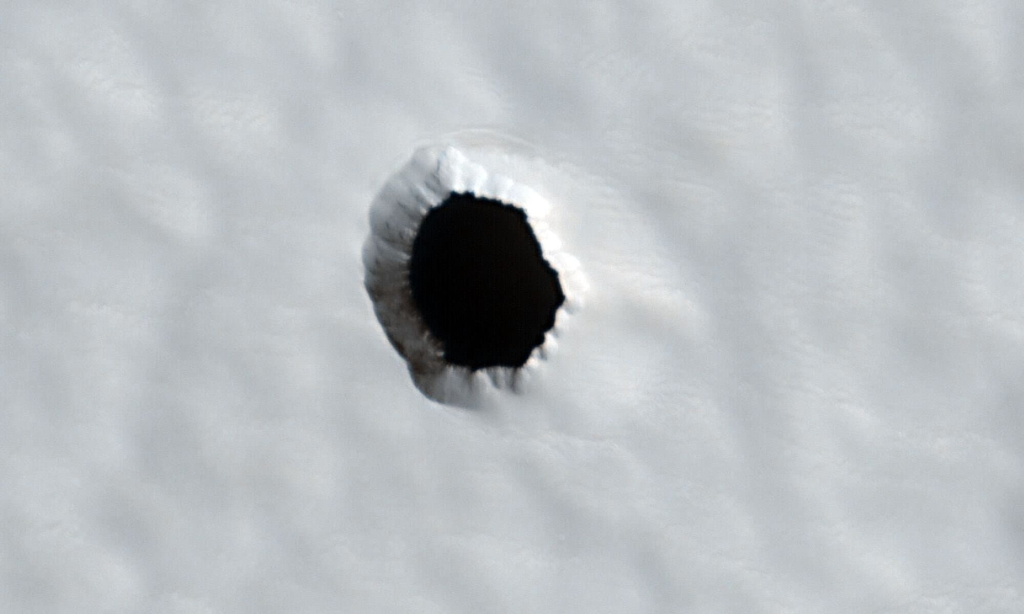 This Mysterious Hole on Mars Could Be Key to Keeping Astronauts Alive There