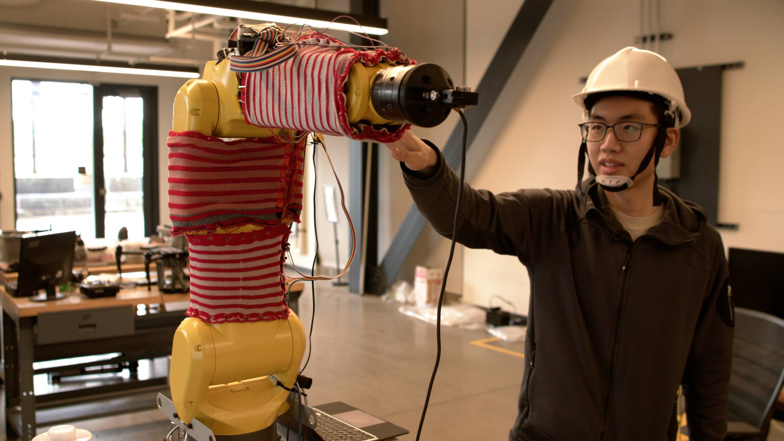 Sweater-Wrapped Robots Can Feel and React to Human Touch