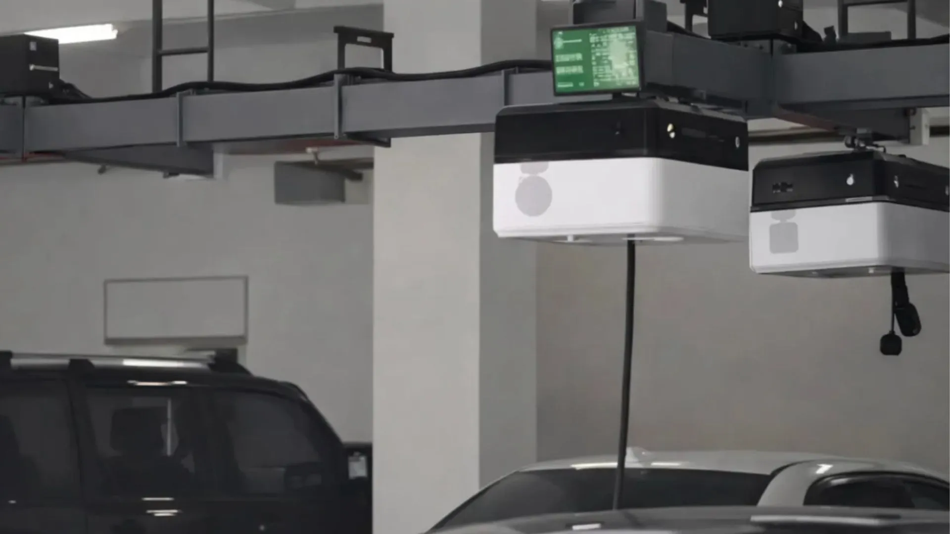 Ceiling-mounted charging robot in China rolls on rails to power EVs