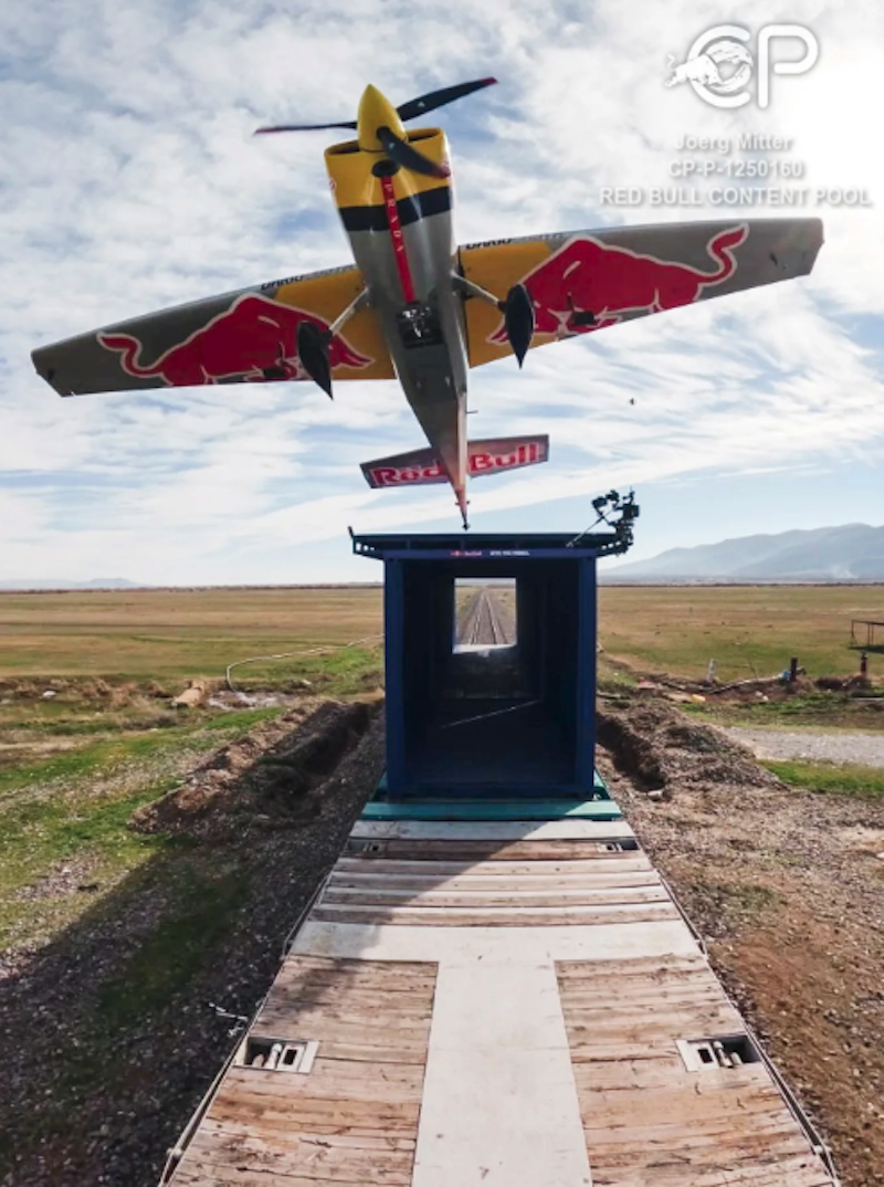 Red Bull pilot lands plane on moving cargo train and takes off again in ‘world-first’