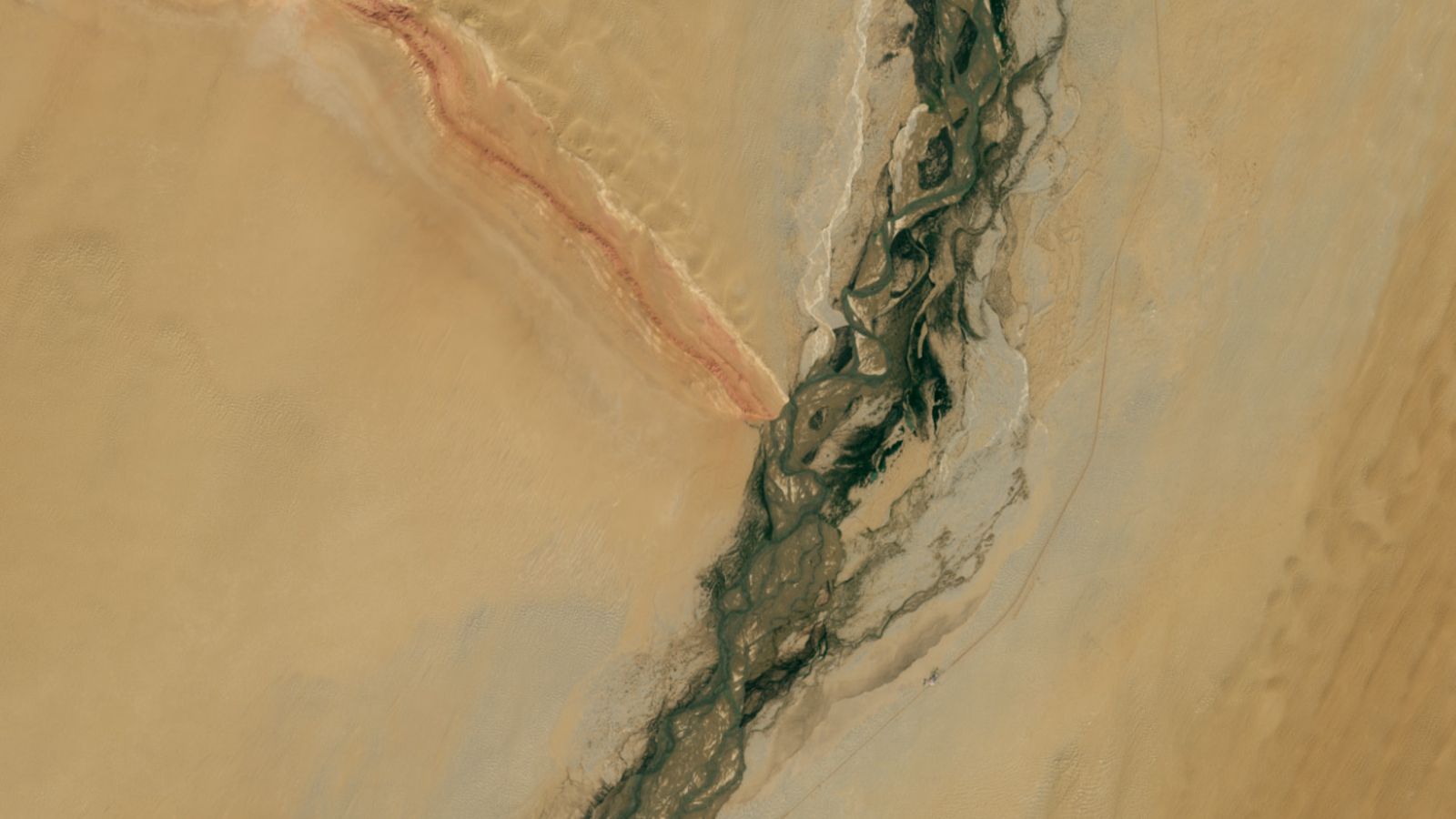 Gemstone-filled river and striped mountain ridge form massive ‘Y’ in China’s revitalized desert — Earth from space