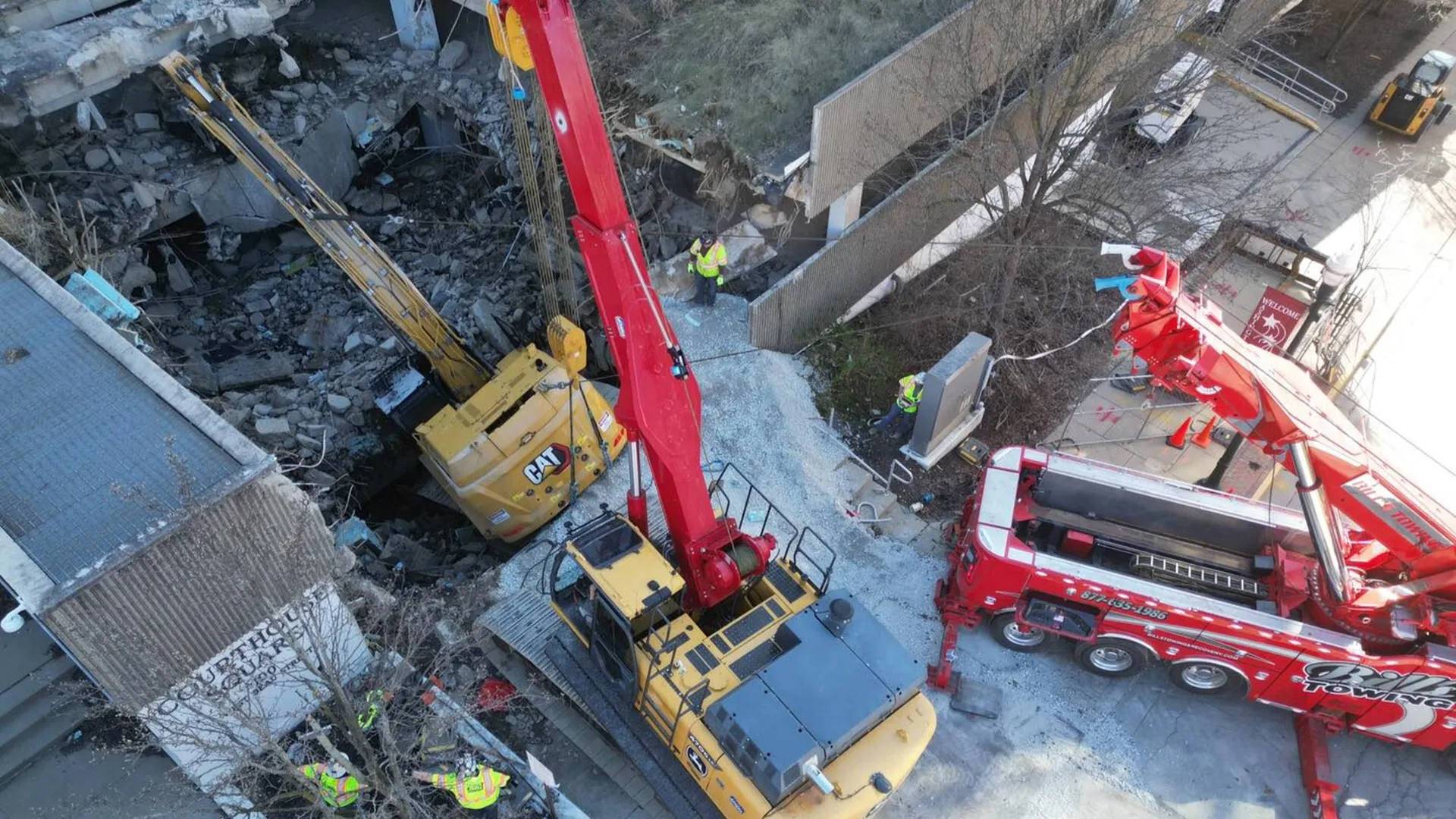 World’s largest tow truck rescues excavator from parking garage