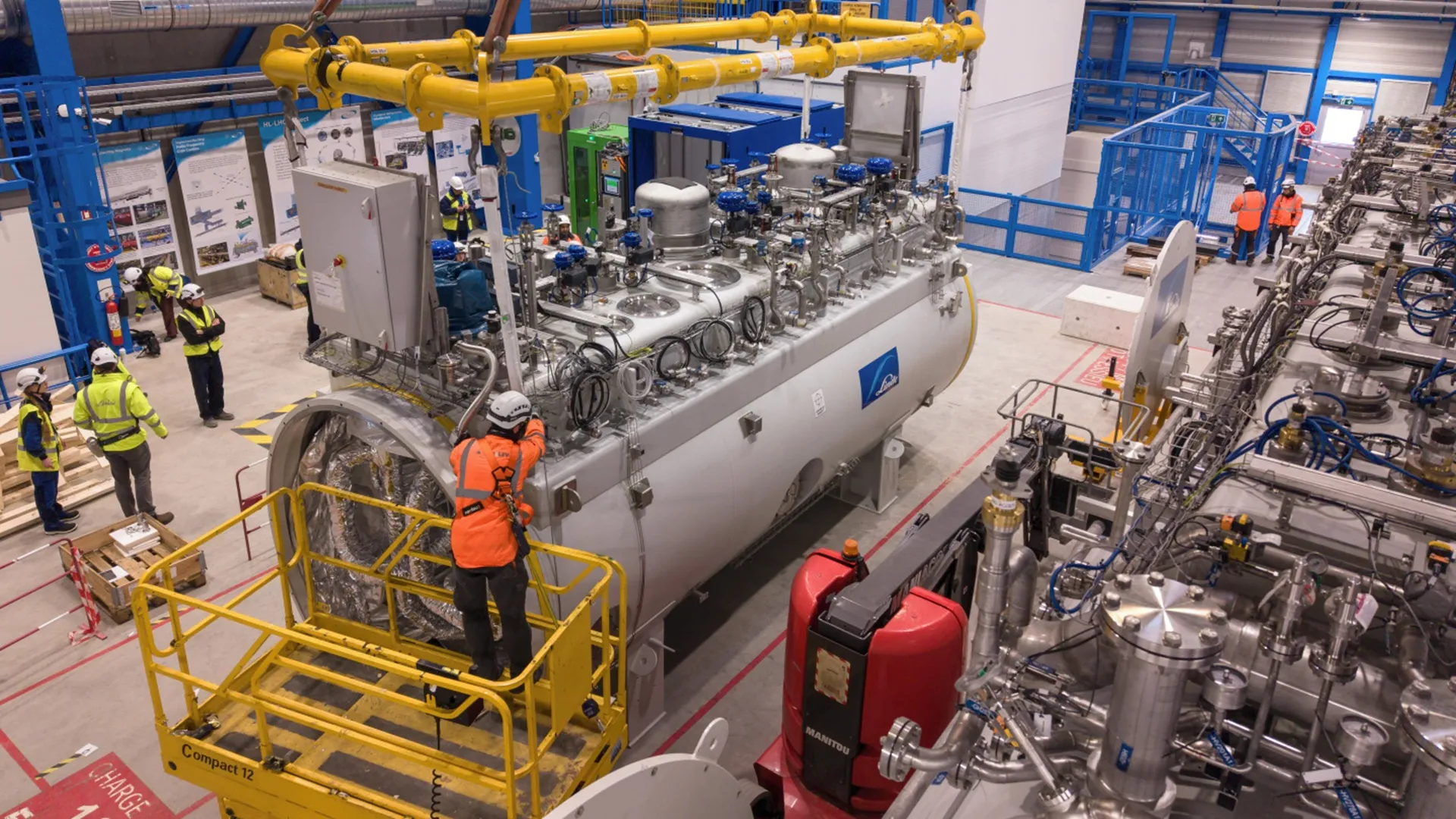Huge cryogenic cold boxes lowered underground for LHC’s major upgrade