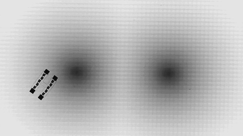 Microscopic swimming robots navigate ‘artificial space-time’ mazes using Einstein’s relativity